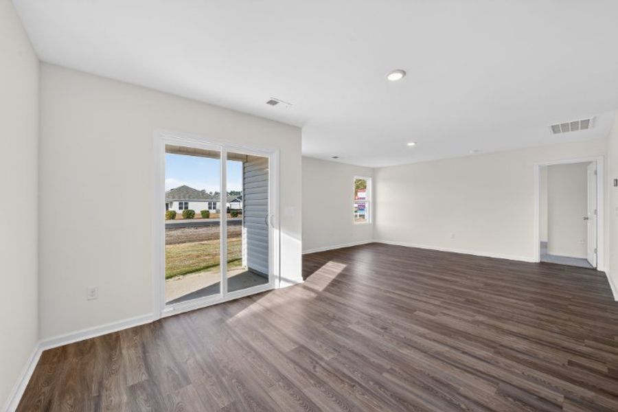 A room with a wood floor and a wood floor.