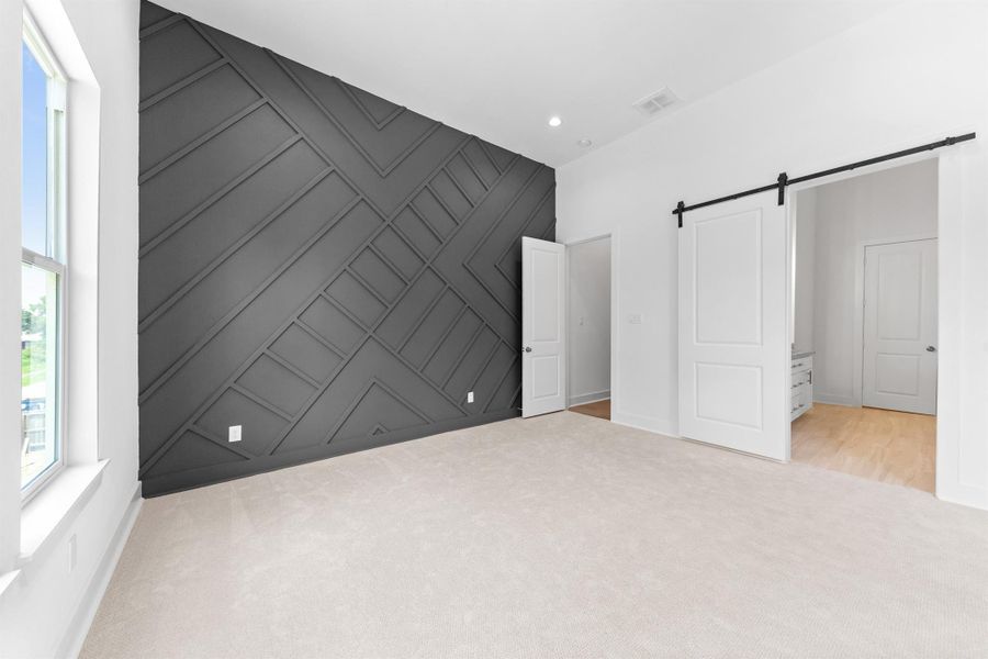 Primary room featuring a stylish accent wall that adds character and depth to the space. Primary room featuring a stylish accent wall that adds character and depth to the space.