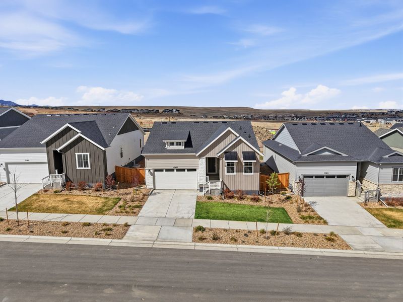 Front exterior of a new home in Trailstone, Arvada, CO, highlighting curb appeal (Image 2). Front exterior of a new home in Trailstone, Arvada, CO, highlighting curb appeal (Image 2).