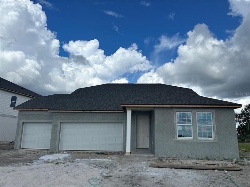 In-progress construction of a new home in Oakfield Trails Signature, Parrish, FL (Image 8).