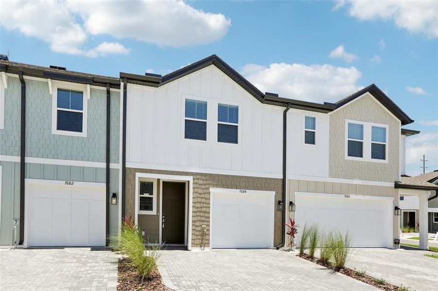 Front exterior of a new home in Montague Chase, Tampa, FL, highlighting curb appeal (Image 1).