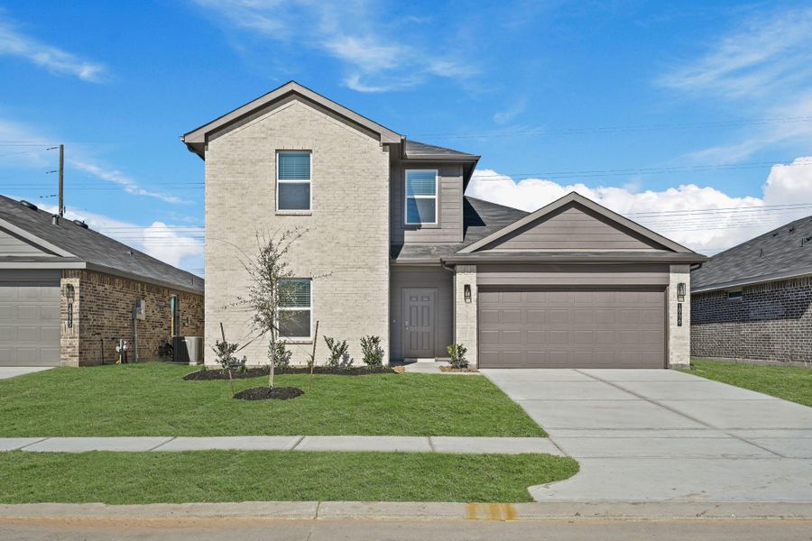 Front exterior of a new home in Porters Mill, New Caney, TX, highlighting curb appeal (Image 13).