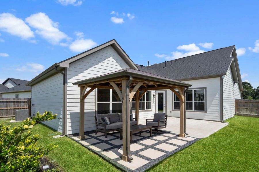 Relax and entertain in your private Portico courtyard, a beautiful outdoor oasis perfect for morning coffee, evening gatherings, or peaceful gardening. Image depicts home as-is.
