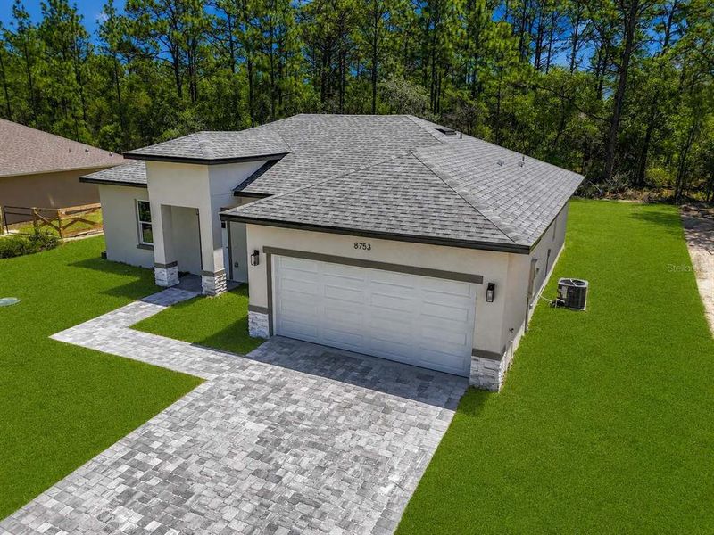 Front exterior of a new home in , Citrus Springs, FL, highlighting curb appeal (Image 21). Front exterior of a new home in , Citrus Springs, FL, highlighting curb appeal (Image 21).