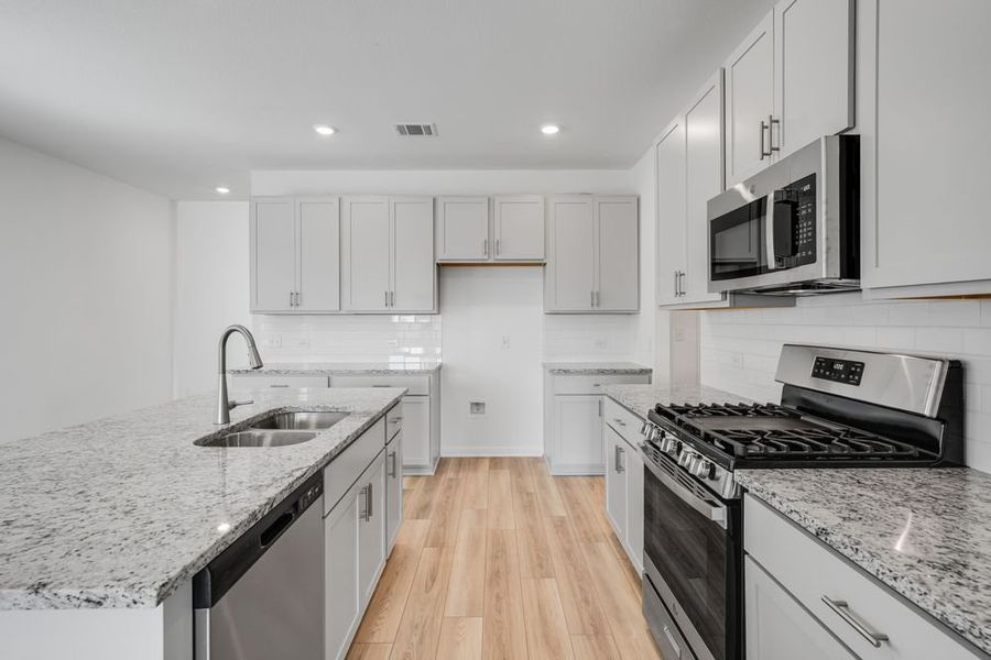 Furnished interior view inside a new home in Longview 40s, Del Valle (Image 9).