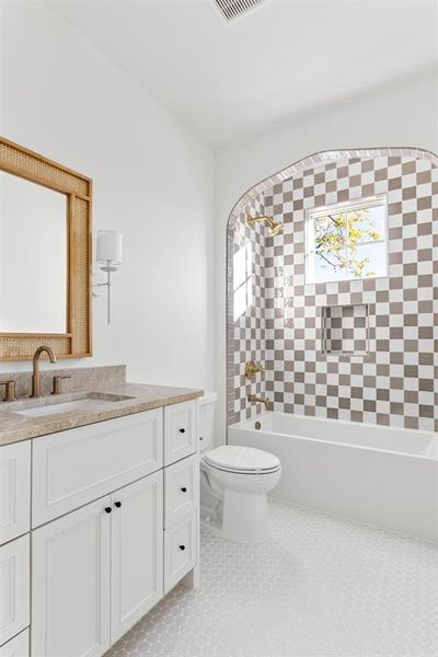Bathroom with shower / washtub combination, vanity, and light tile patterned floors Bathroom with shower / washtub combination, vanity, and light tile patterned floors