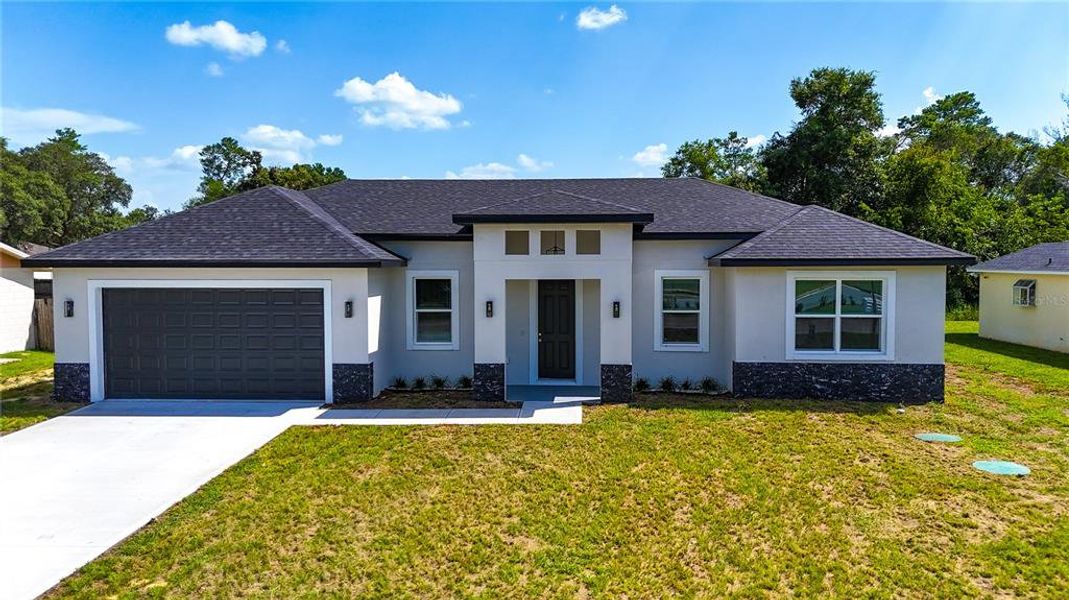 Front exterior of a new home in , Ocala, FL, highlighting curb appeal (Image 24).
