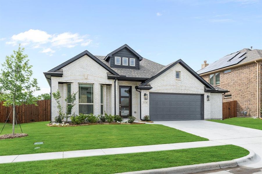 Front exterior of a new home in Ridge Ranch, Mesquite, TX, highlighting curb appeal (Image 1). Front exterior of a new home in Ridge Ranch, Mesquite, TX, highlighting curb appeal (Image 1).