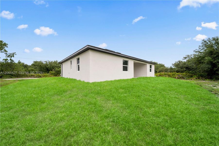 Exterior details and patio area of a home in , Lehigh Acres (Image 3). Exterior details and patio area of a home in , Lehigh Acres (Image 3).