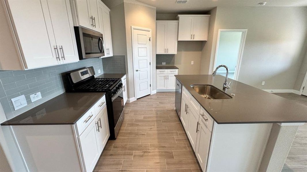 Kitchen - All Home and community information, including pricing, included features, terms, availability and amenities, are subject to change at any time without notice or obligation. All Drawings, pictures, photographs, video, square footages, floor plans, elevations, features, colors and sizes are approximate for illustration purposes only and will vary from the homes as built.