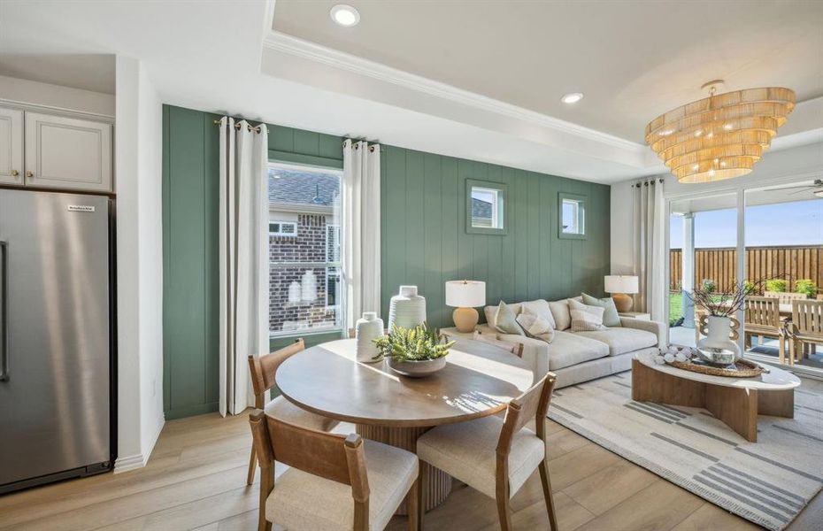Formal dining room with large windows *Model Representation*