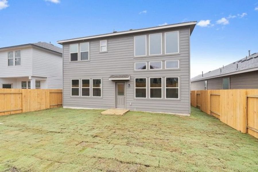 Front exterior of a new home in Morningstar, Georgetown, TX, highlighting curb appeal (Image 8).