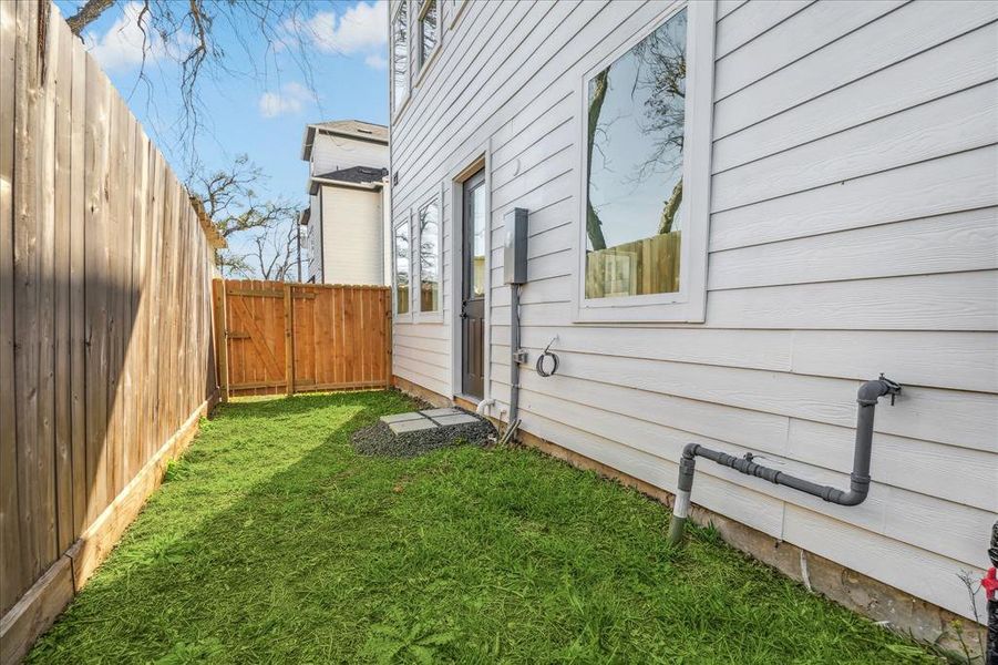 Fully fenced backyard space, located off the living area with an access gate leading to the side yard.  A perfect spot for your furry friends.