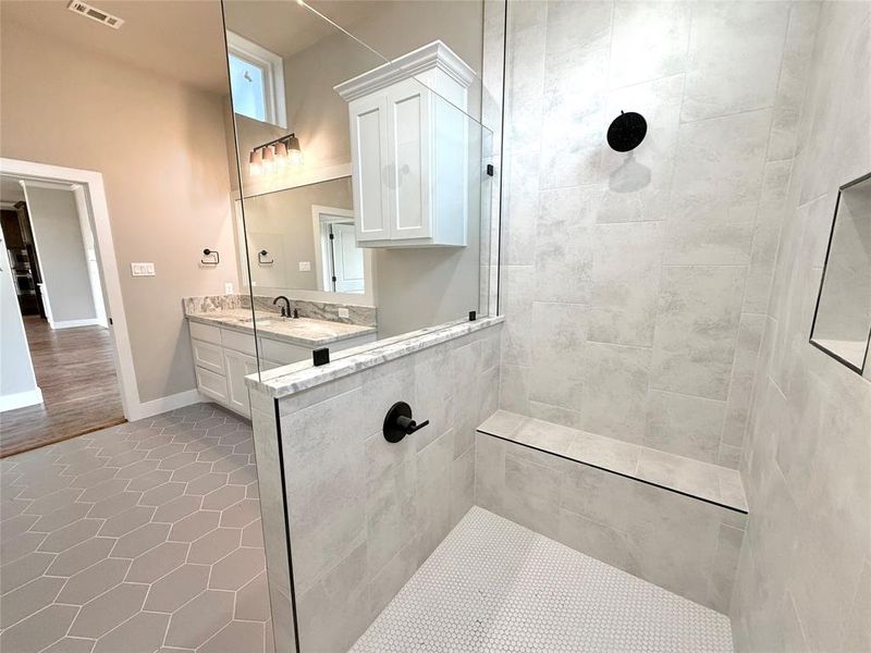 Full bathroom featuring walk in shower, light tile patterned floors, and vanity Full bathroom featuring walk in shower, light tile patterned floors, and vanity