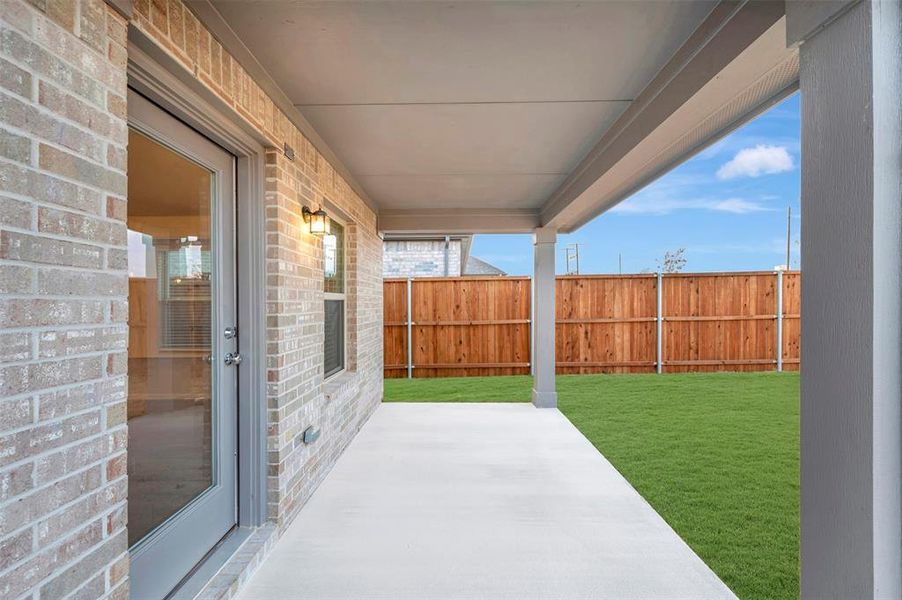 Exterior details and patio area of a home in The Preserve, Justin (Image 3).