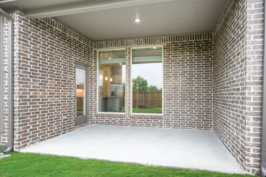 Exterior details and patio area of a home in Terracina, Rockwall (Image 27).