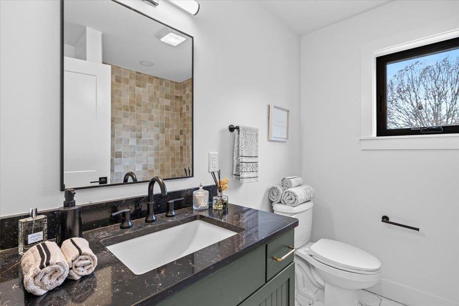 Bathroom featuring toilet and vanity