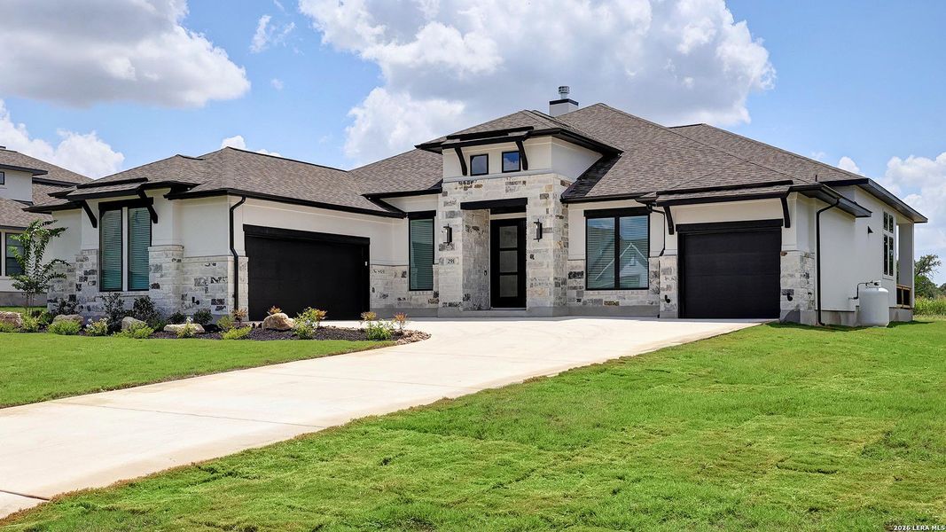 Front exterior of a new home in Megan's Landing, Castroville, TX, highlighting curb appeal (Image 24).
