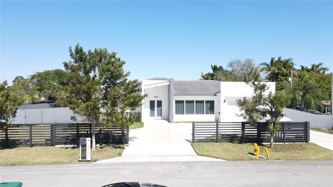 Front exterior of a new home in , Homestead, FL, highlighting curb appeal (Image 2). Front exterior of a new home in , Homestead, FL, highlighting curb appeal (Image 2).