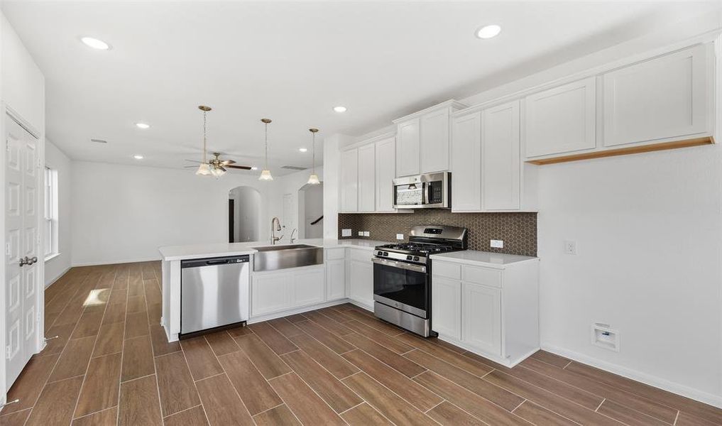 Kitchen overlooks great room (*Photo not of actual home and used for illustration purposes only.)