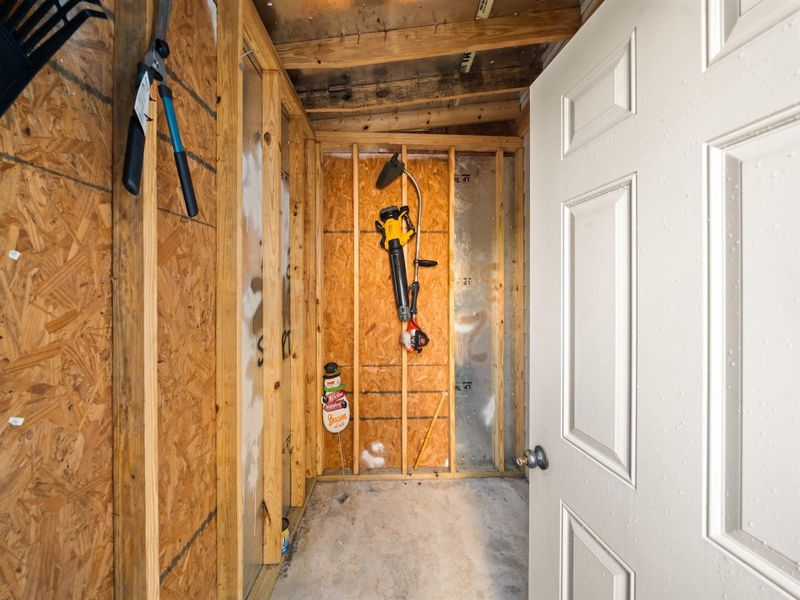 Just to the right of the rear patio, a 10' x 10' storage shed.