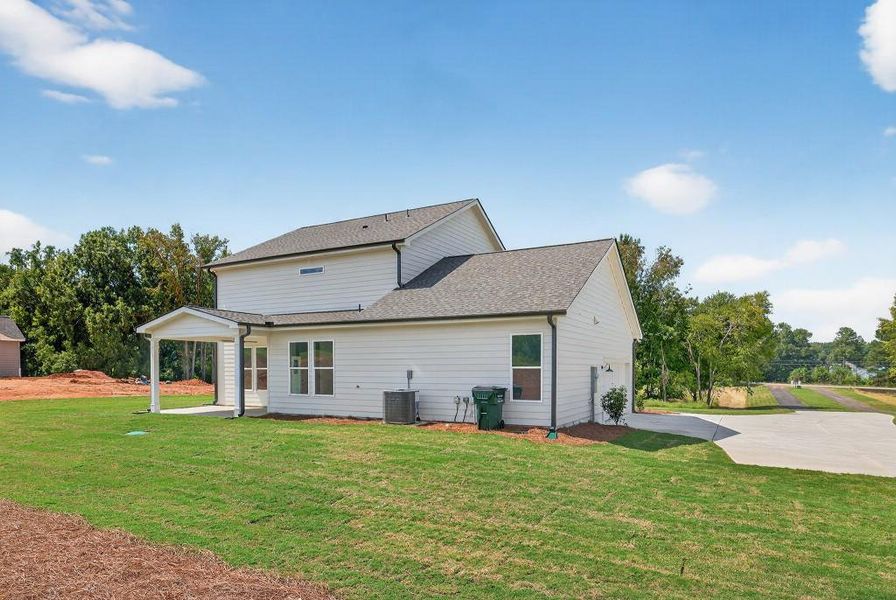 Front exterior of a new home in Magnolia Ridge, Monroe, GA, highlighting curb appeal (Image 20).