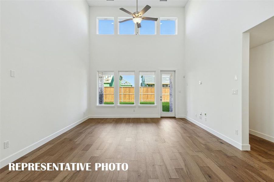 Your new family room is flooded with natural light from floor to ceiling windows!  REPRESENTATIVE PHOTO