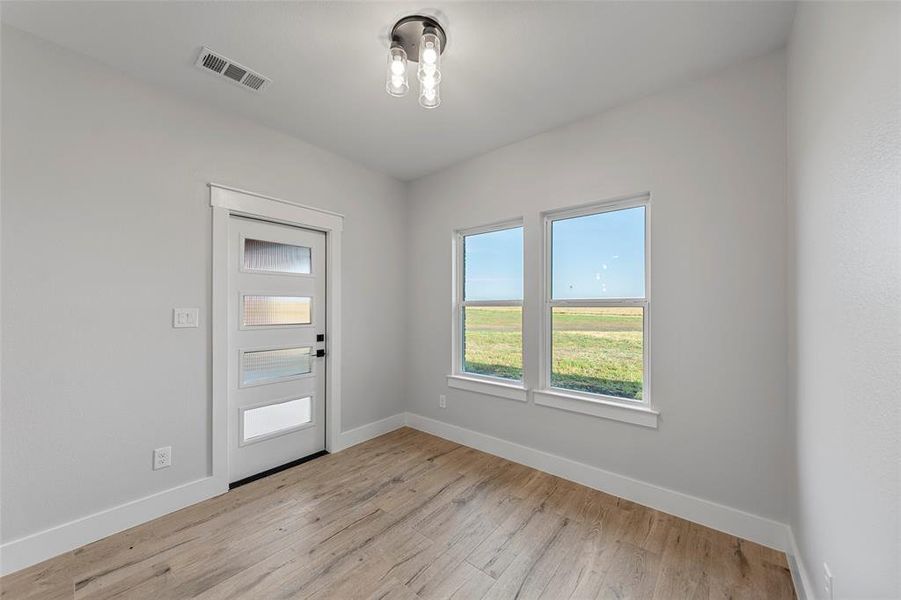 Dining Area with Backyard view and door to the covered patio