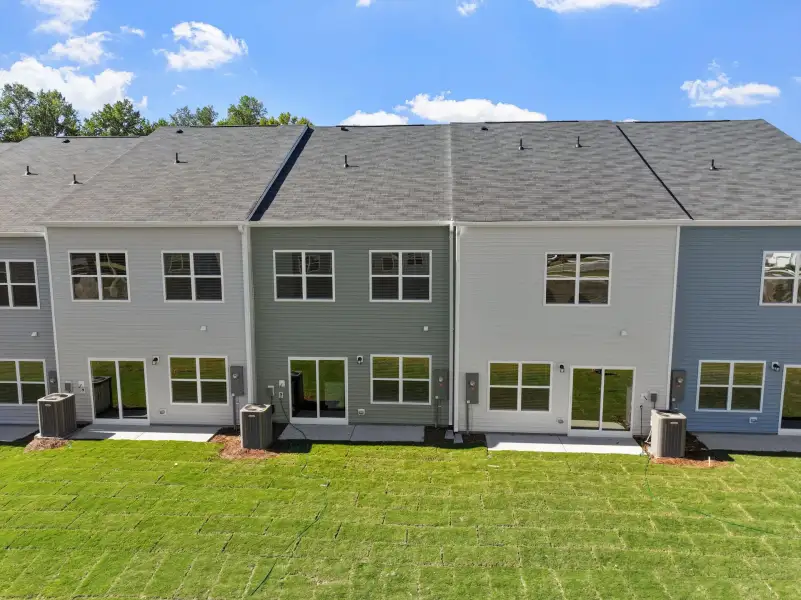 Exterior details and patio area of a home in West Main Townhomes, Sanford (Image 3). Exterior details and patio area of a home in West Main Townhomes, Sanford (Image 3).