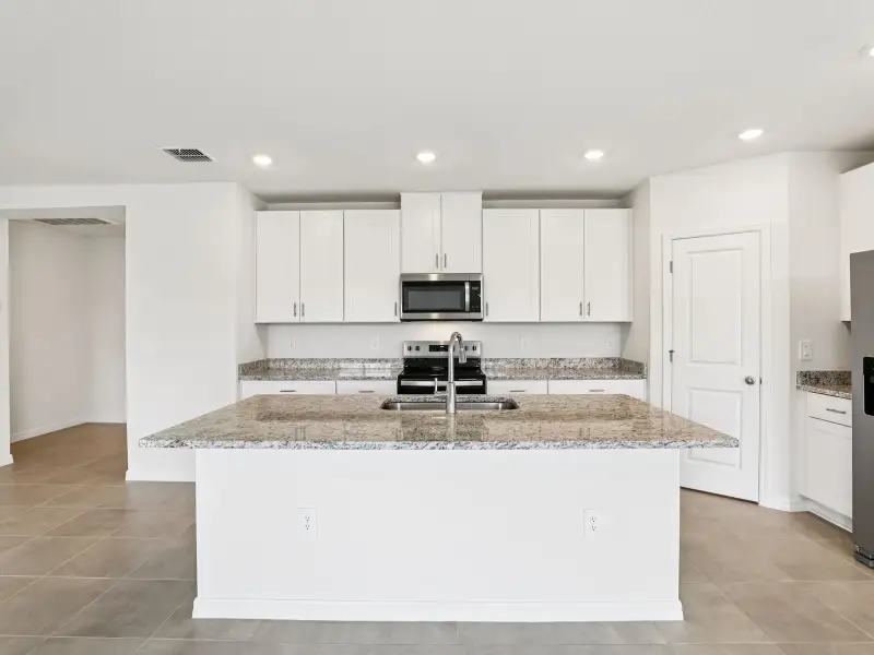 Furnished interior view inside a new home in The Grove at Stuart Crossing - Classic Series, Bartow (Image 3).