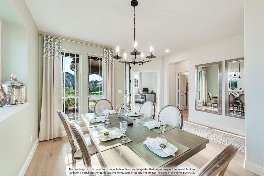 Dining room with wood table, six chairs, chandelier, and large windows with patio view