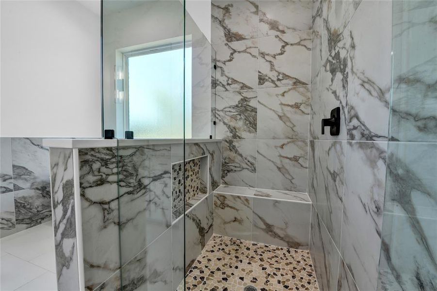 Bathroom with tiled shower