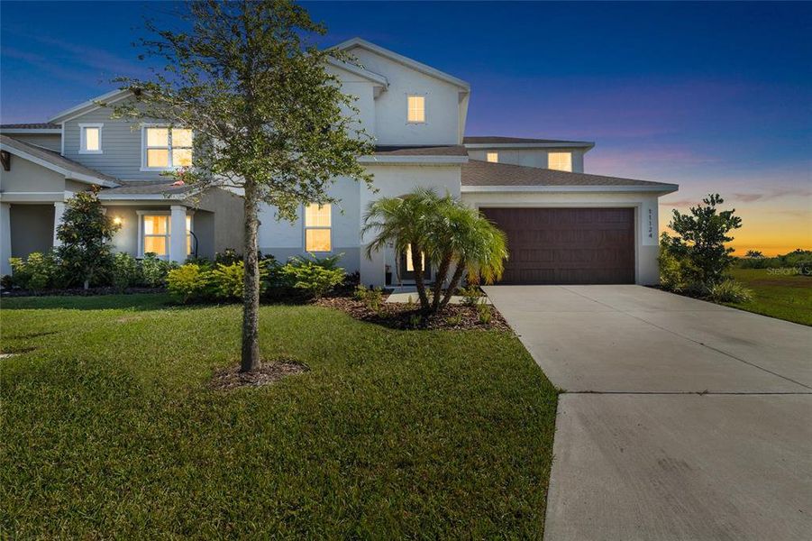 Front exterior of a new home in Isles at Bayview, Parrish, FL, highlighting curb appeal (Image 23).