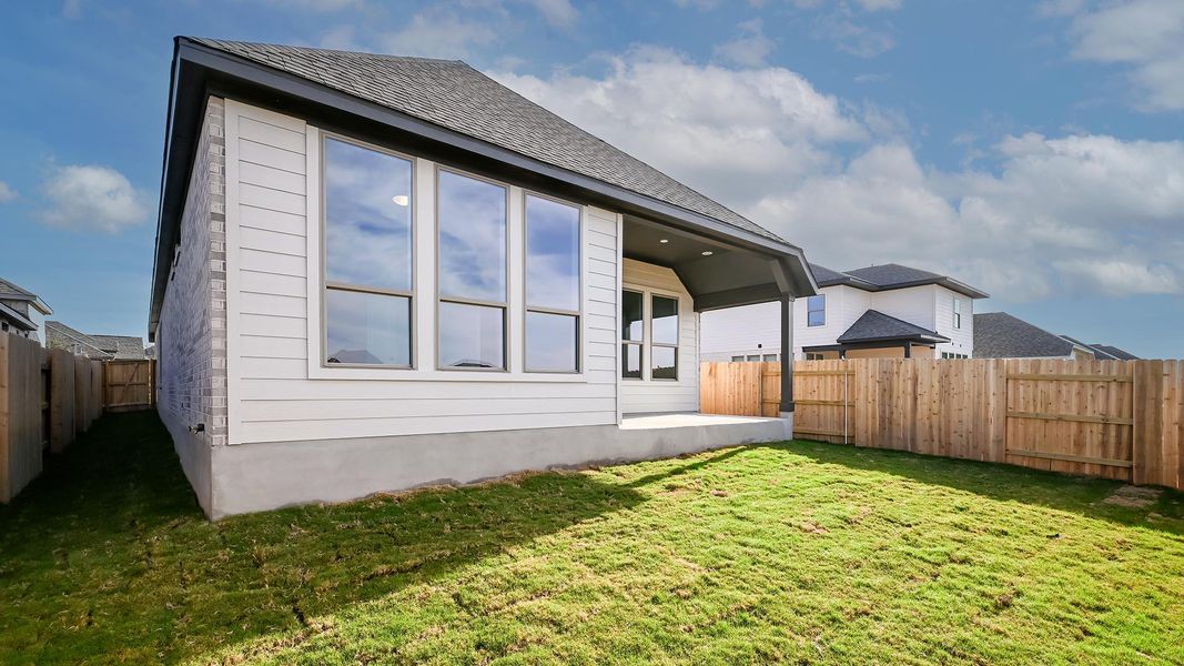Exterior details and patio area of a home in Crosswinds 40', Kyle (Image 3).