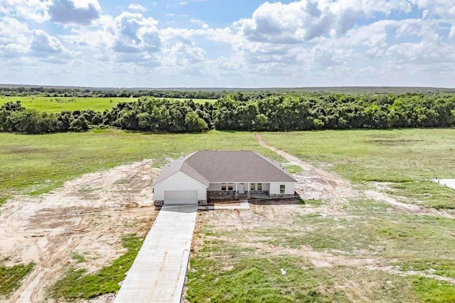 Birds eye view of property with a rural view