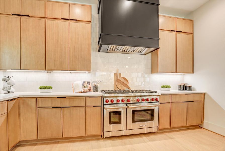 A close up of the cooking area with Wolf range.