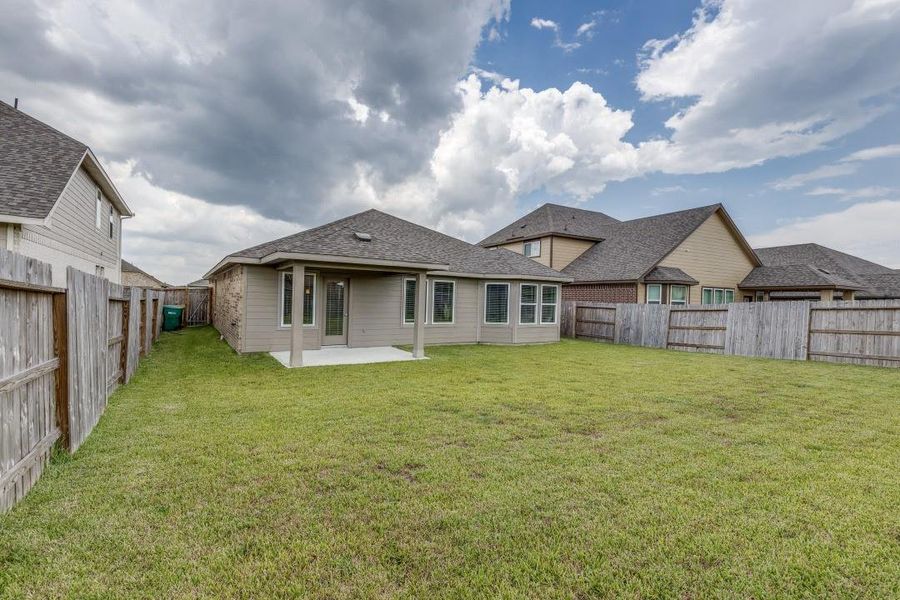 Front exterior of a new home in Sierra Vista, Iowa Colony, TX, highlighting curb appeal (Image 23). Front exterior of a new home in Sierra Vista, Iowa Colony, TX, highlighting curb appeal (Image 23).