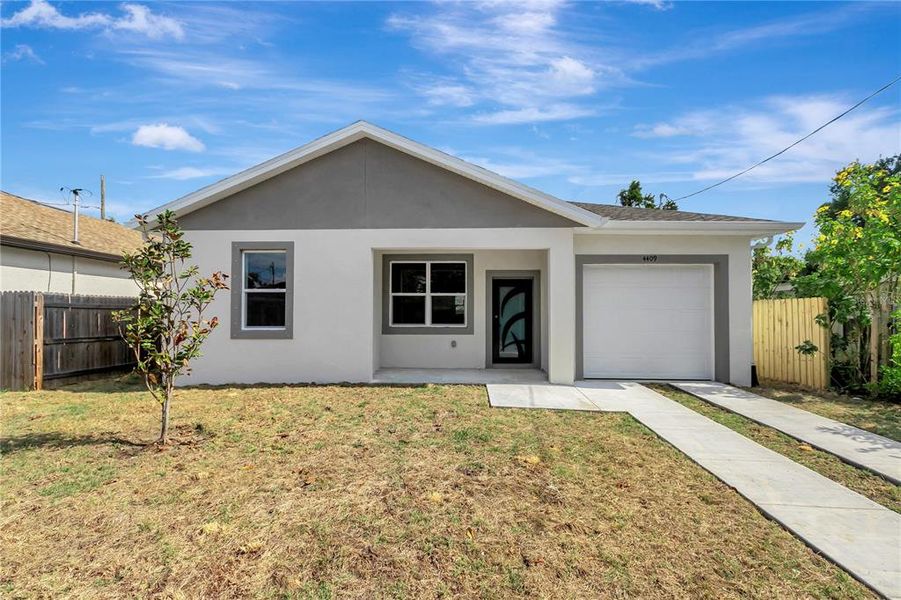 Front exterior of a new home in , Tampa, FL, highlighting curb appeal (Image 24). Front exterior of a new home in , Tampa, FL, highlighting curb appeal (Image 24).