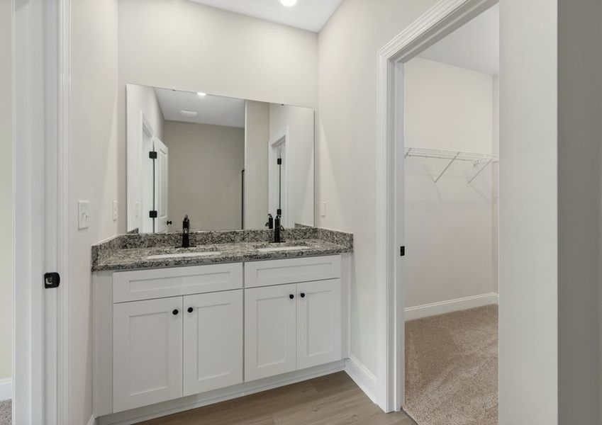 The master bathroom has a glass-enclosed shower The master bathroom has a glass-enclosed shower