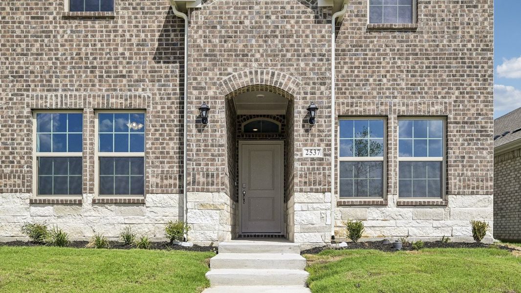 Exterior details and patio area of a home in Magnolia at Legacy Hills, Celina (Image 2). Exterior details and patio area of a home in Magnolia at Legacy Hills, Celina (Image 2).