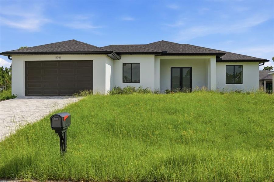 Front exterior of a new home in , Port Charlotte, FL, highlighting curb appeal (Image 1). Front exterior of a new home in , Port Charlotte, FL, highlighting curb appeal (Image 1).