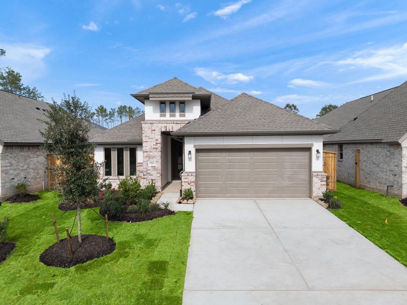 Front exterior of a new home in The Highlands, Porter, TX, highlighting curb appeal (Image 20).