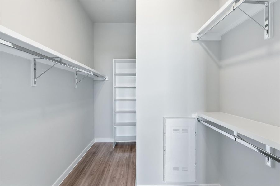 Walk in closet featuring wood finished floors