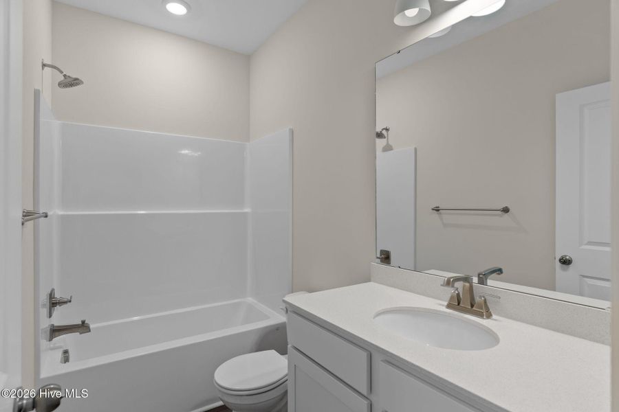 Furnished interior view inside a new home in Coastal Haven Townes, Leland (Image 14).