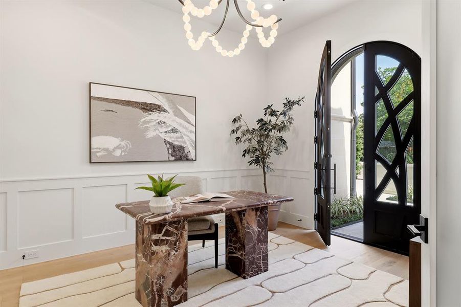The private home office, complemented by its own front courtyard, elevates the work-from-home experience.