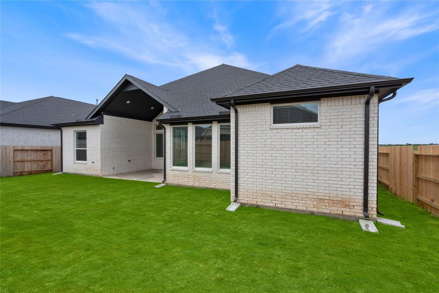 Front exterior of a new home in Brookewater, Rosenberg, TX, highlighting curb appeal (Image 2).
