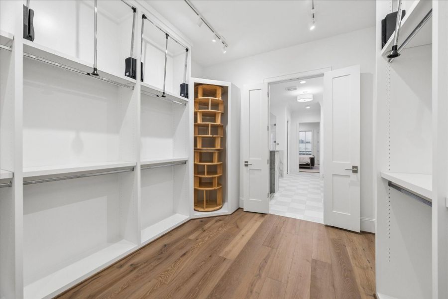 Another view of the closet with custom shelves.