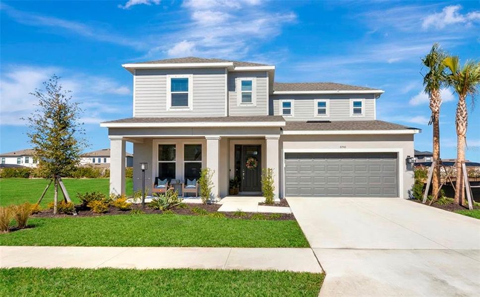 Front exterior of a new home in Skye Ranch Community Group Page, Sarasota, FL, highlighting curb appeal (Image 25).