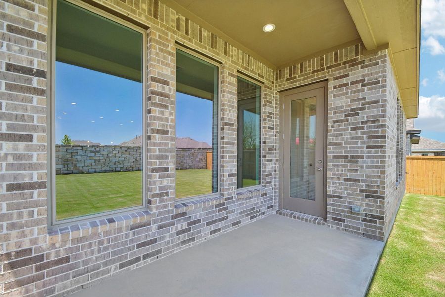 Exterior details and patio area of a home in 6 Creeks, Kyle (Image 21).