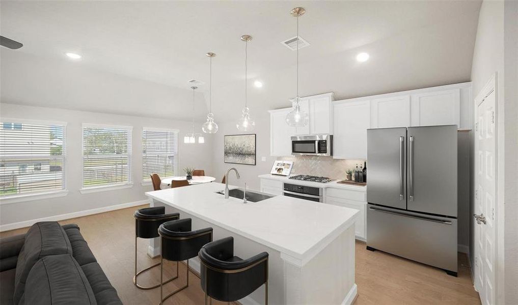 This 2nd floor kitchen receives natural lighting from the windows in the space.